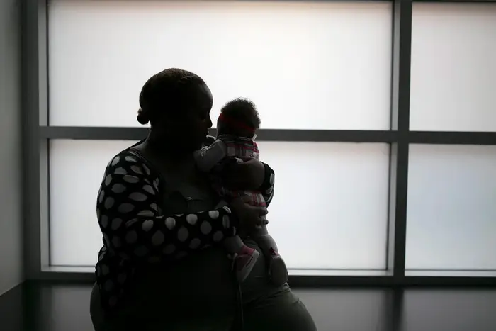 A Bronx mother, shown here in silouette, was investigated by child welfare authorities in 2019 after her newborn tested positive for marijuana at birth. The city removed the newborn from her mother's care, until a family court judge ordered that the two be reunited.
